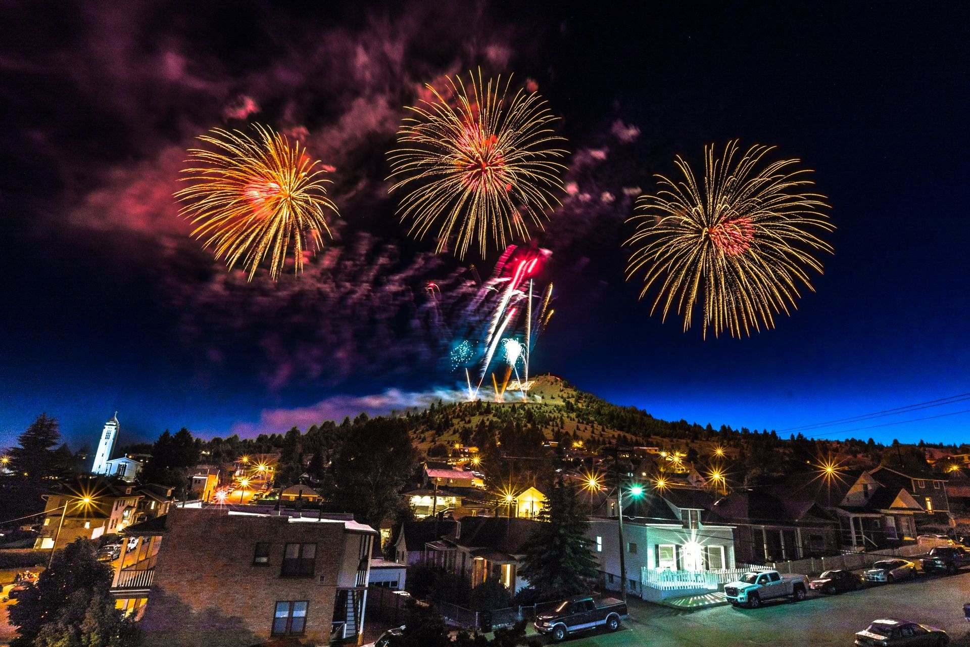 Fireworks exploding in the night sky over  Butte, MT