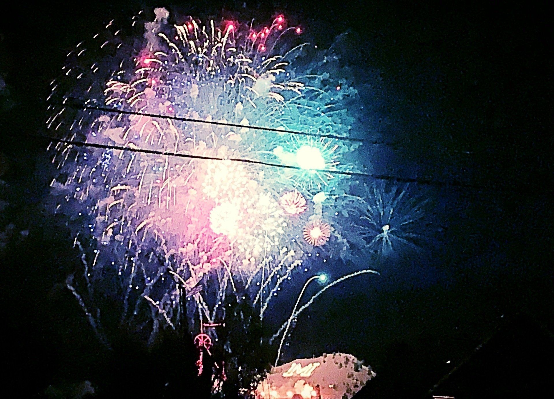 Fireworks exploding in the night sky over  Butte, MT