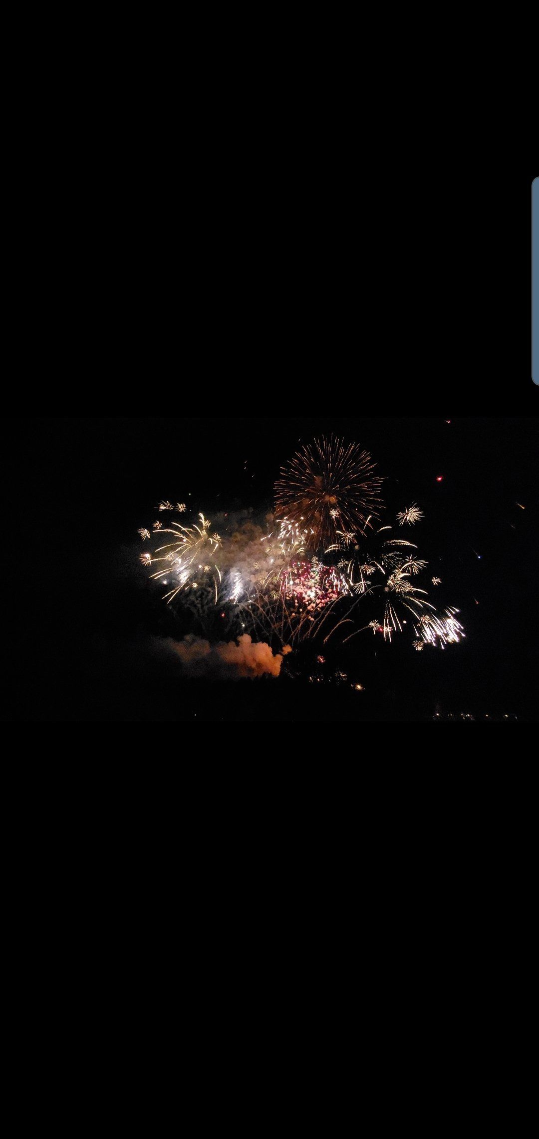 Fireworks exploding in the night sky over  Butte, MT