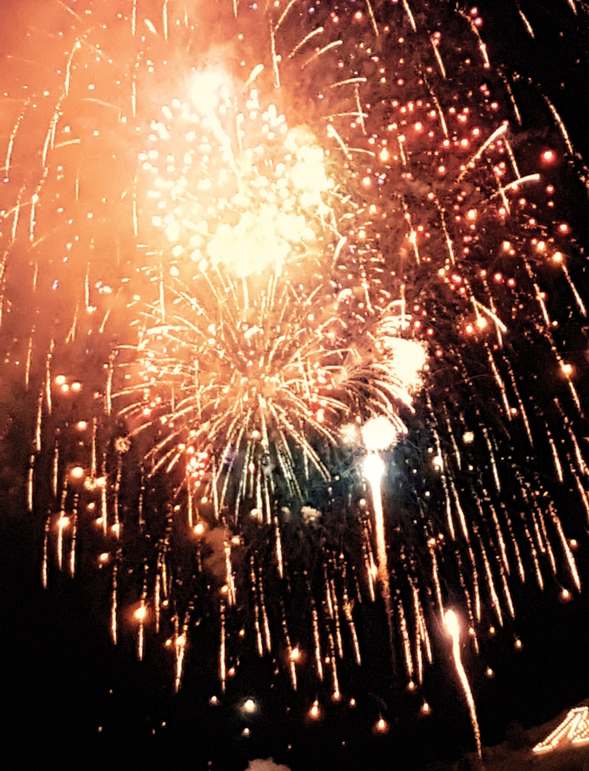 Fireworks exploding in the night sky over  Butte, MT