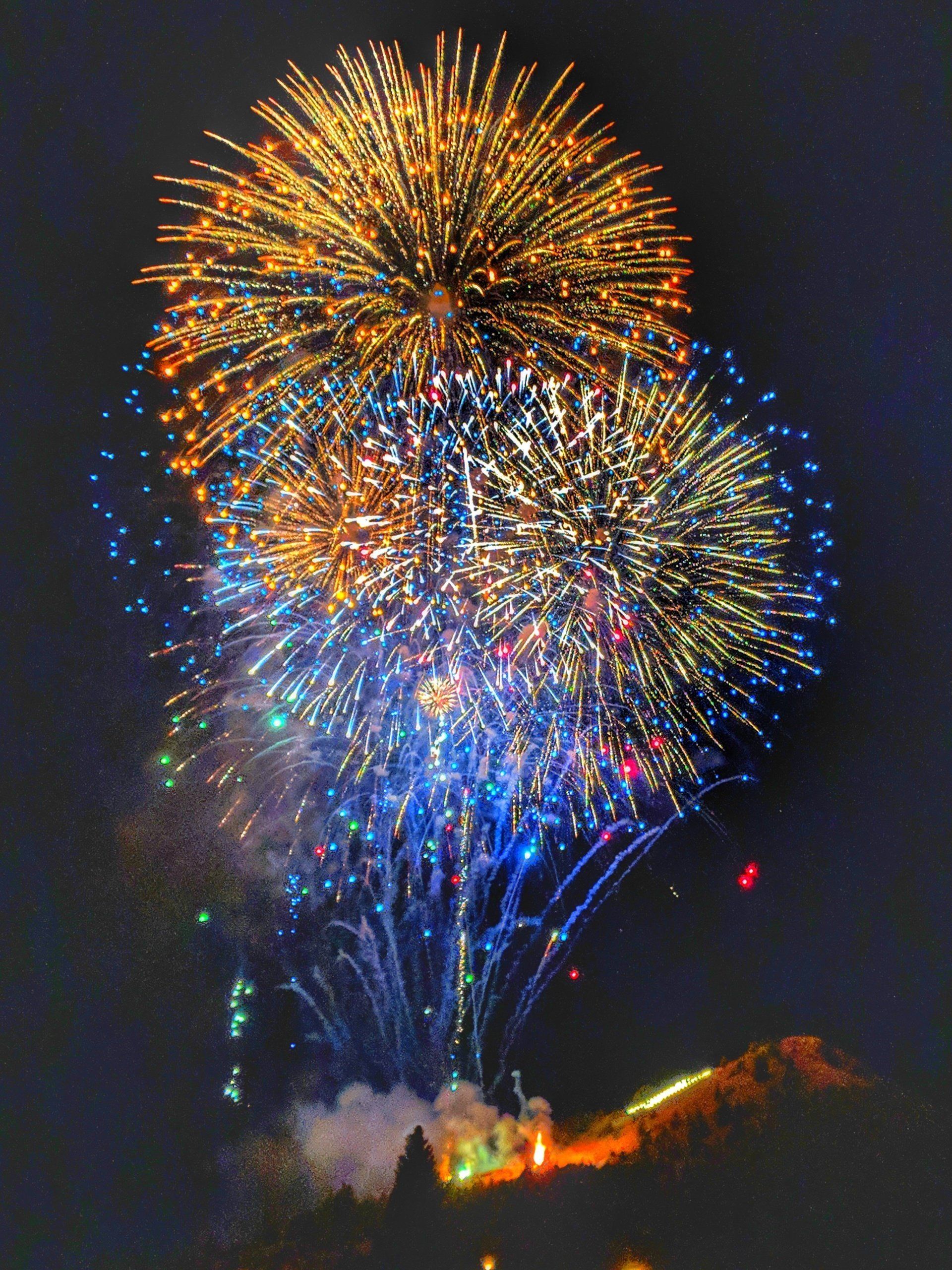 Fireworks exploding in the night sky over  Butte, MT