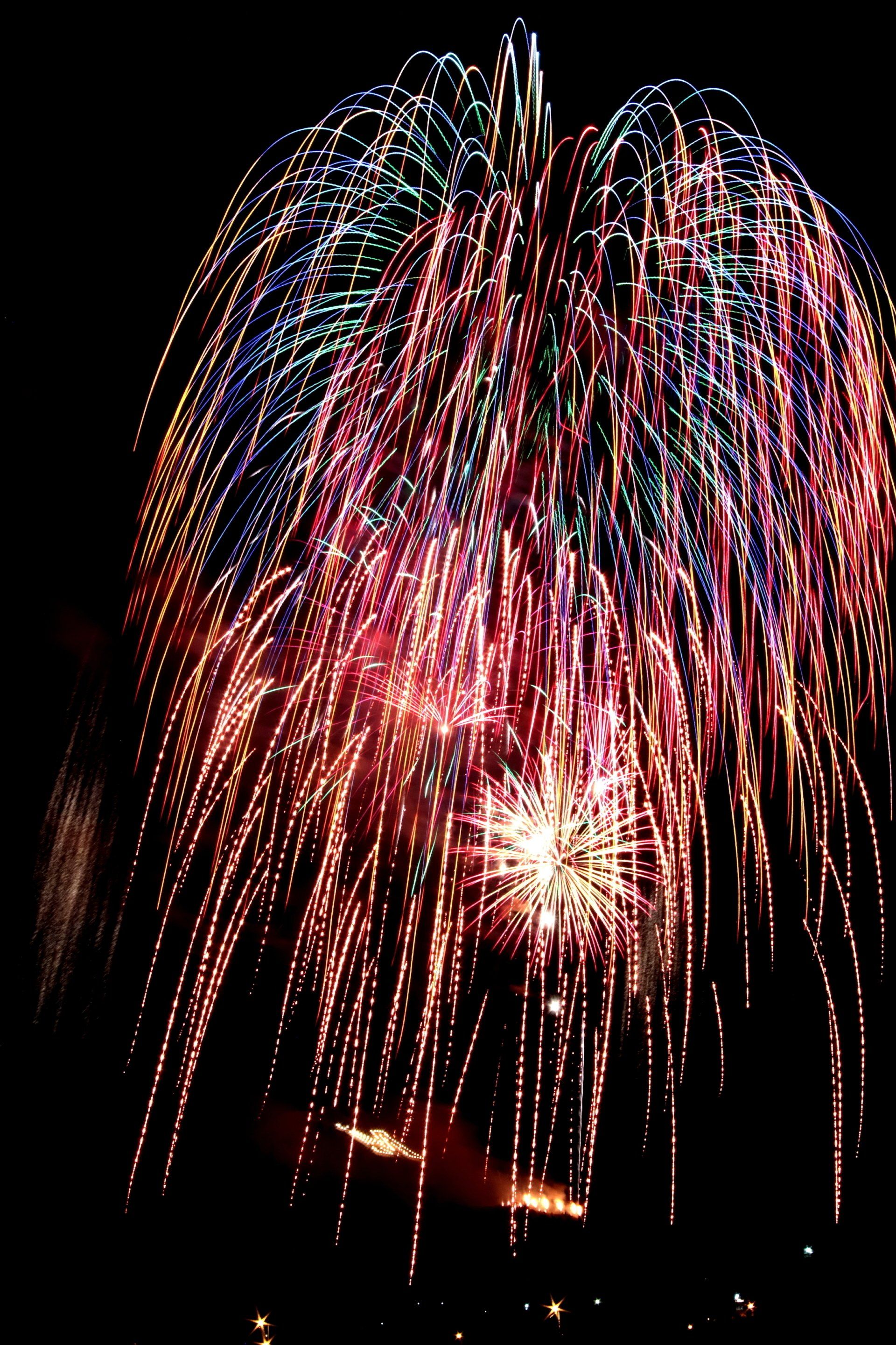 Fireworks exploding in the night sky over  Butte, MT