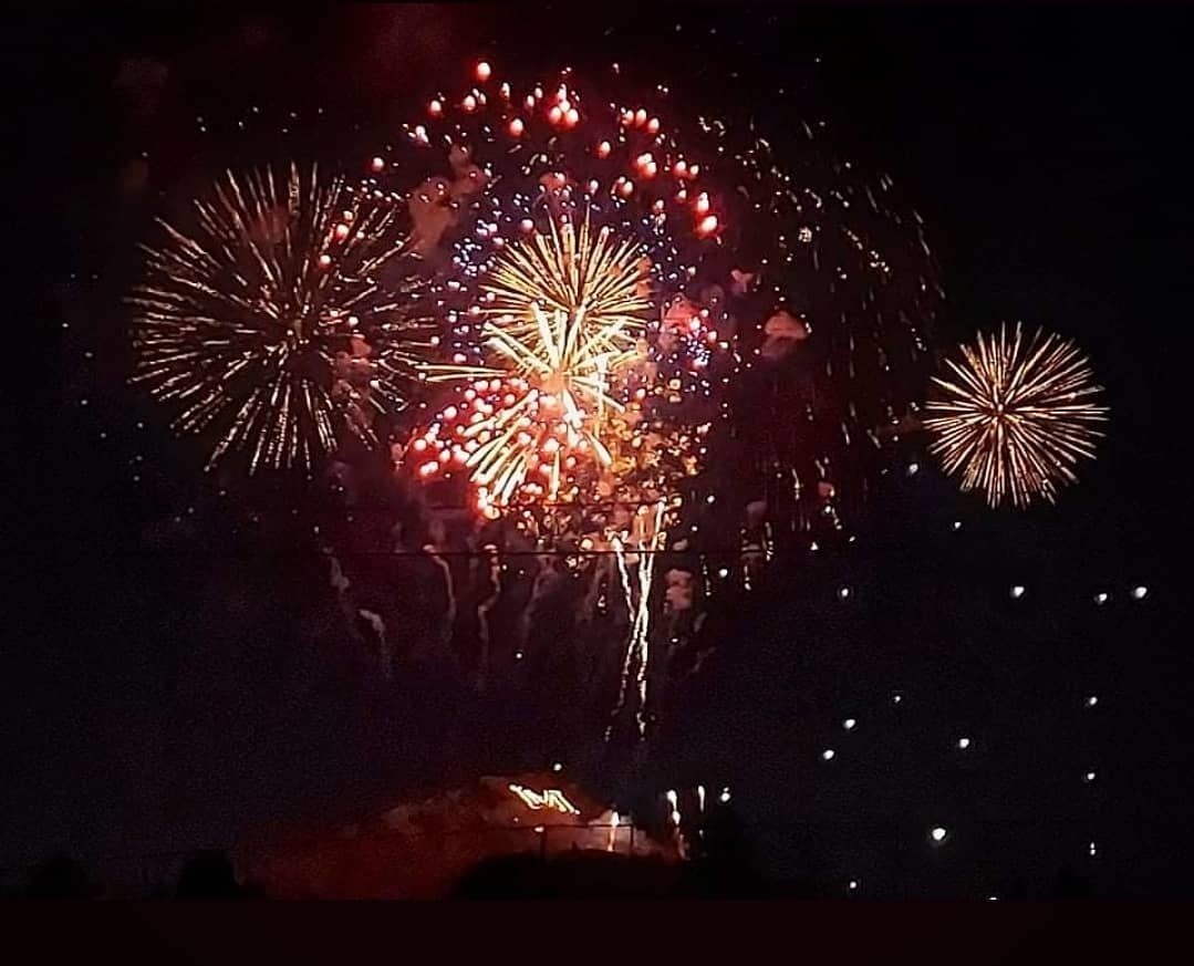 Fireworks exploding in the night sky over  Butte, MT