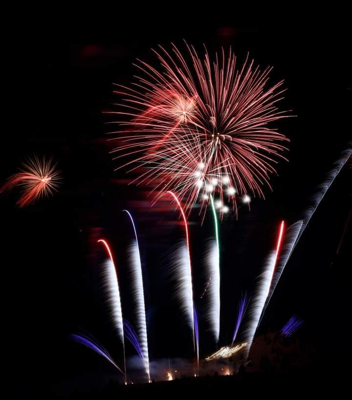 Fireworks exploding in the night sky over  Butte, MT