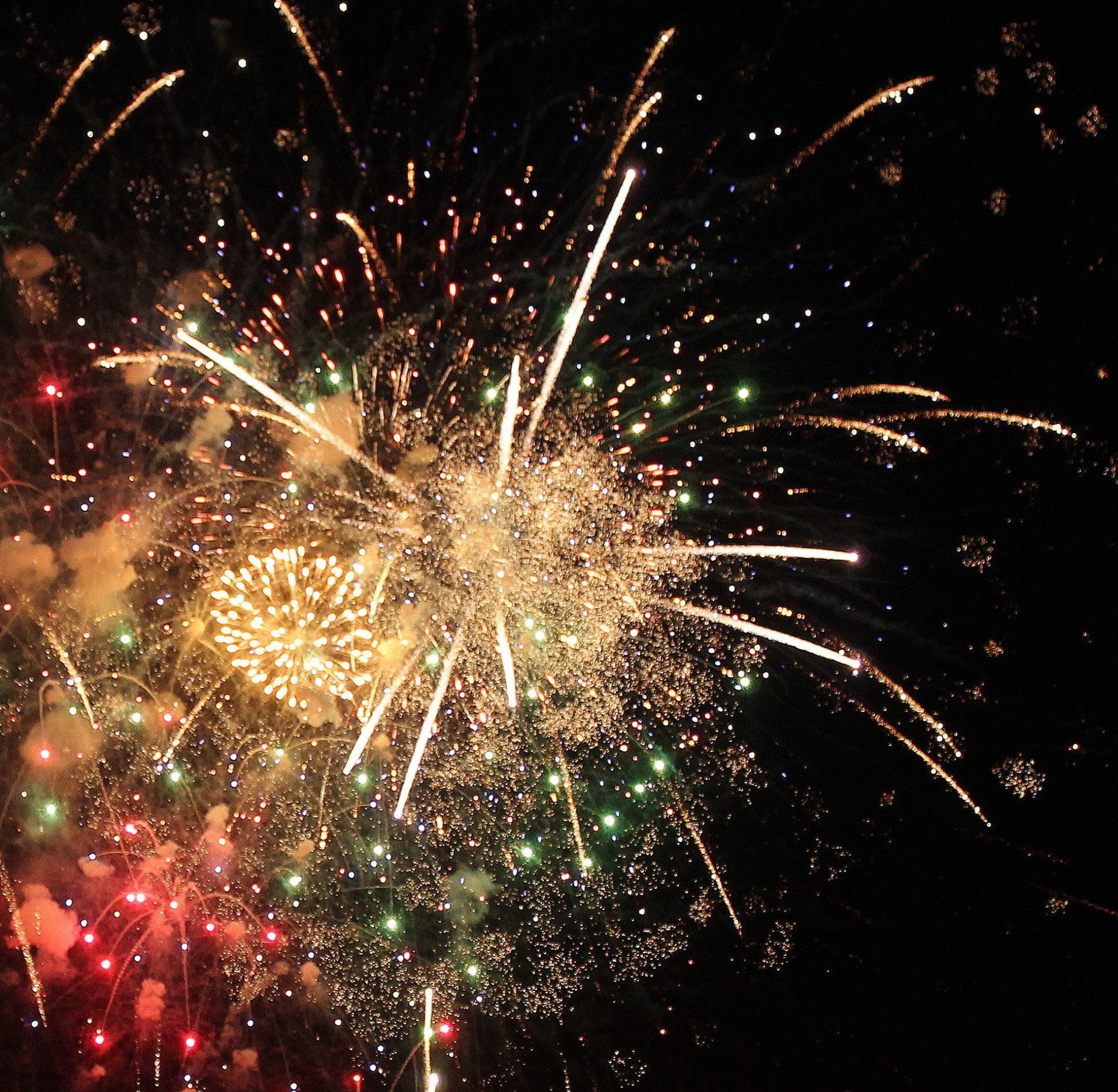 Fireworks exploding in the night sky over  Butte, MT