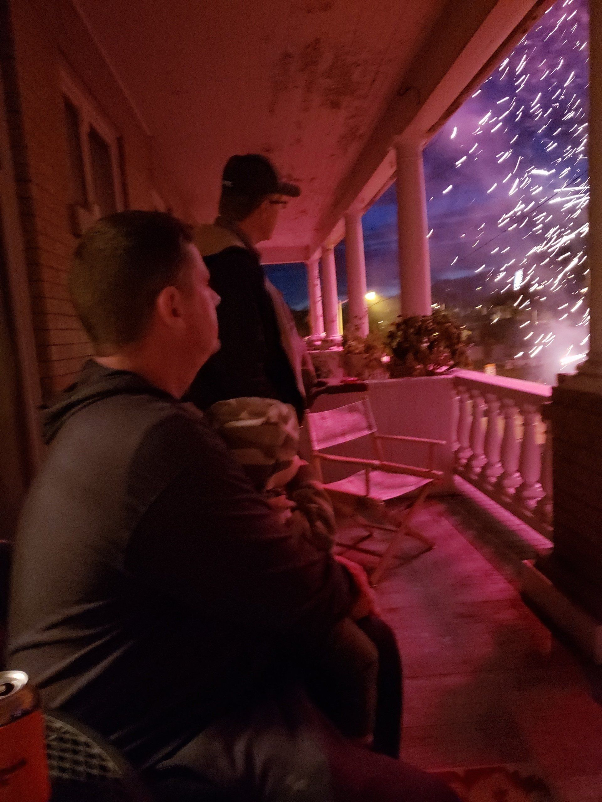 individuals watching fireworks exploding in the night sky over  Butte, MT