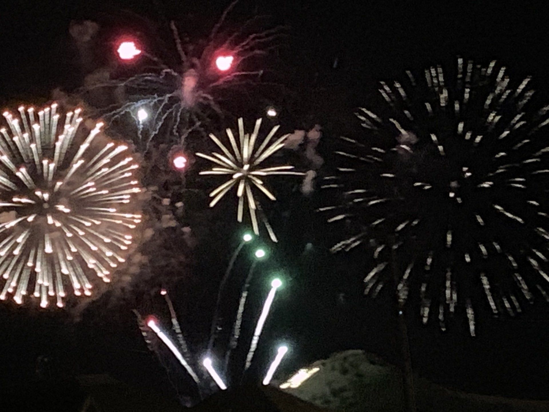 Fireworks exploding in the night sky over  Butte, MT