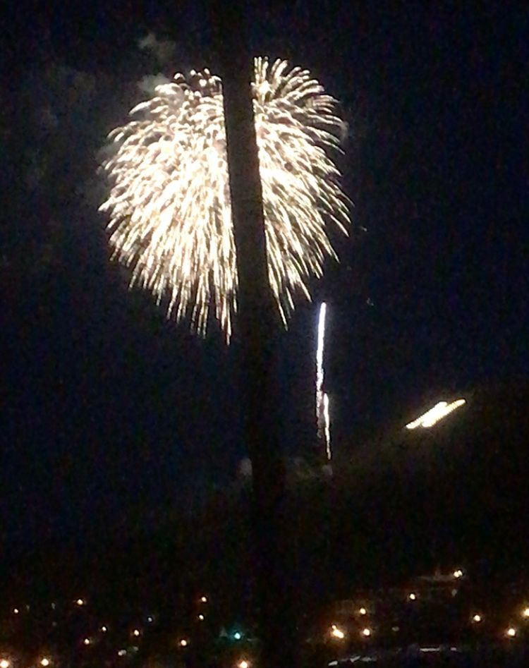 Fireworks exploding in the night sky over  Butte, MT