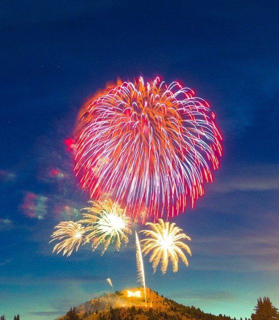 Austin McGrann Fireworks exploding in the night sky over  Butte, MT