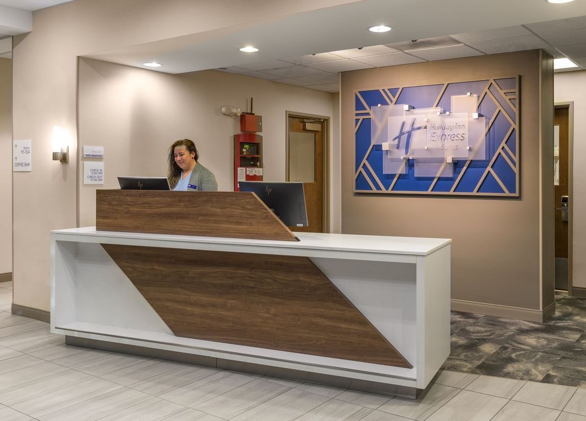 Friendly Staff member at hotel front desk