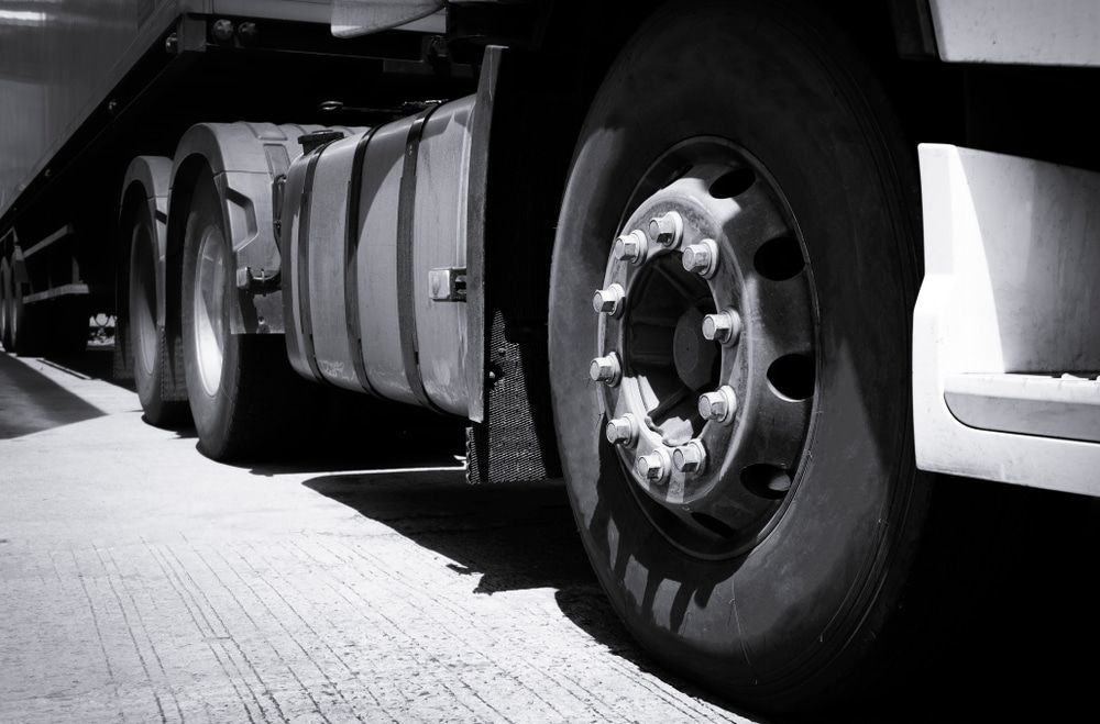 A Black and White Photo of A Semi Truck 's Tires — Docs Mobile Tyre Service in Maroochydore, QLD