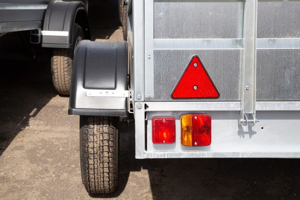 A Trailer With A Red Triangle — Docs Mobile Tyre Service in Bli Bli, QLD