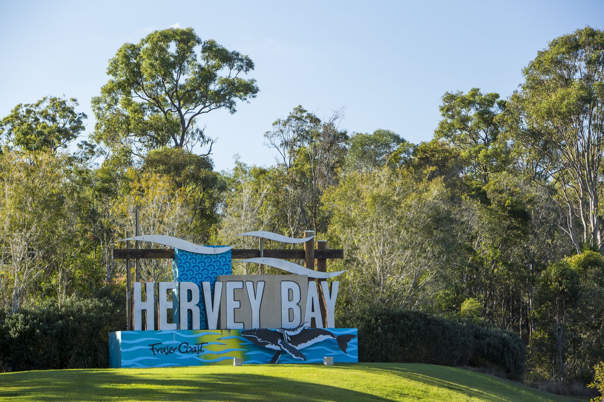 Hervey Bay Sign in A Sunny Park with Trees and Green Grass — Docs Mobile Tyre Service In Hervey Bay, QLD