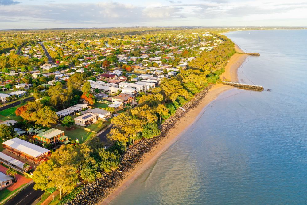 Aerial View of a Coastal Neighborhood Beside a Calm Blue Shoreline — Docs Mobile Tyre Service In Maryborough, QLD