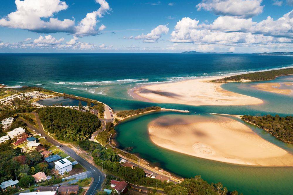 Aerial View of a Turquoise River Meeting the Ocean Beside Sandy Spits — Docs Mobile Tyre Service In River Heads, QLD