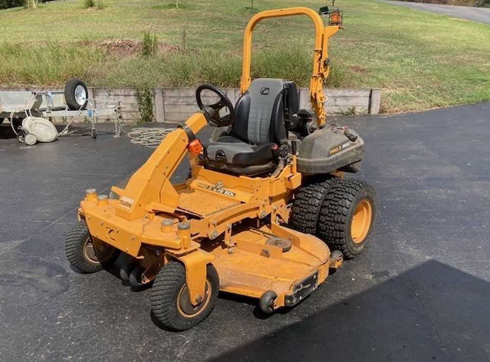 A Yellow Lawn Mower Is Parked On The Side Of The Road — Docs Mobile Tyre Service in Bli Bli, QLD