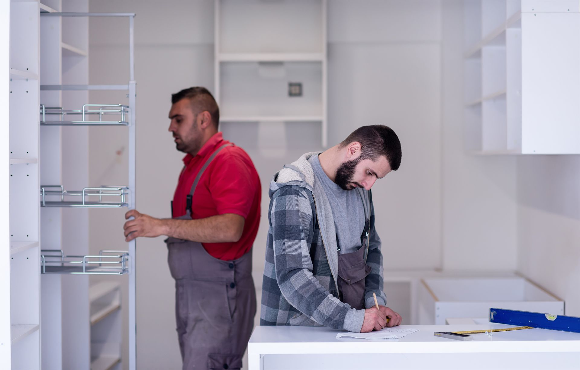 Workers Renovating a House Kitchen