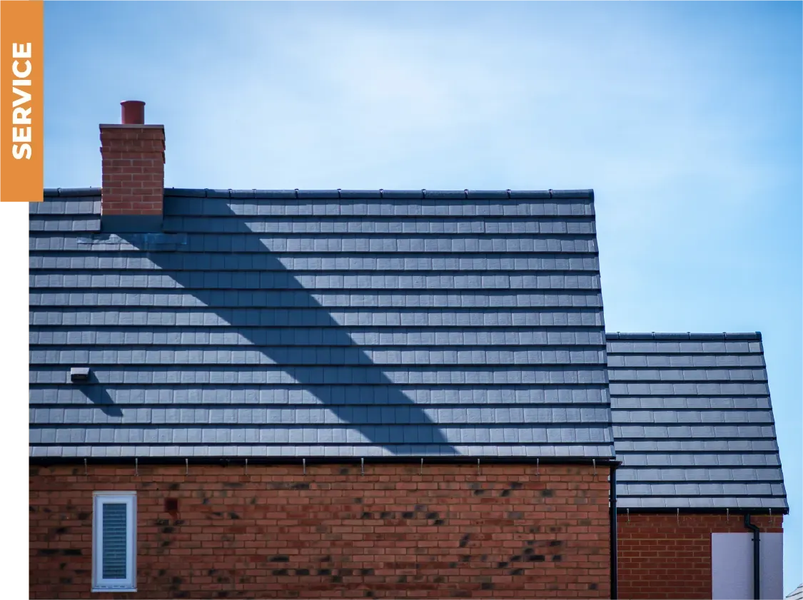 A brick house with a roof that says service on it