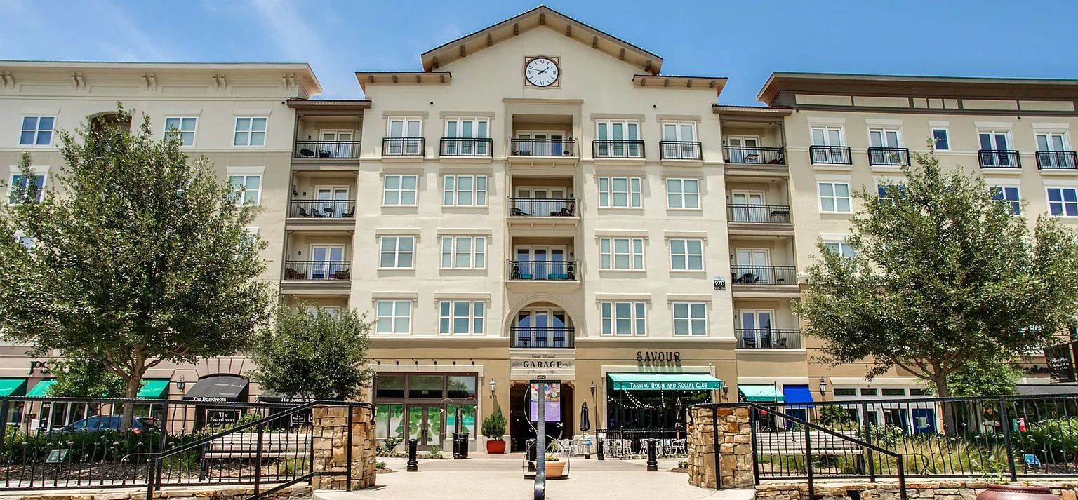 A large building with a clock on the top of it.