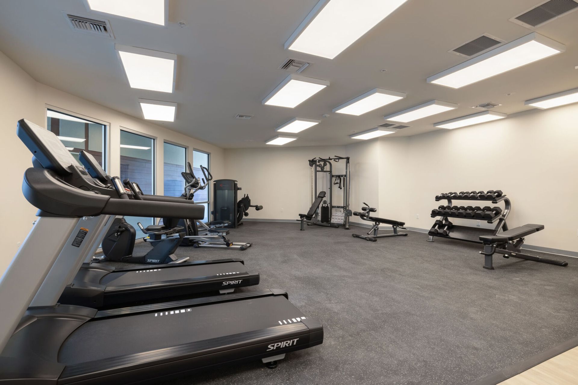 Interior view of a fitness center with various gym equipment