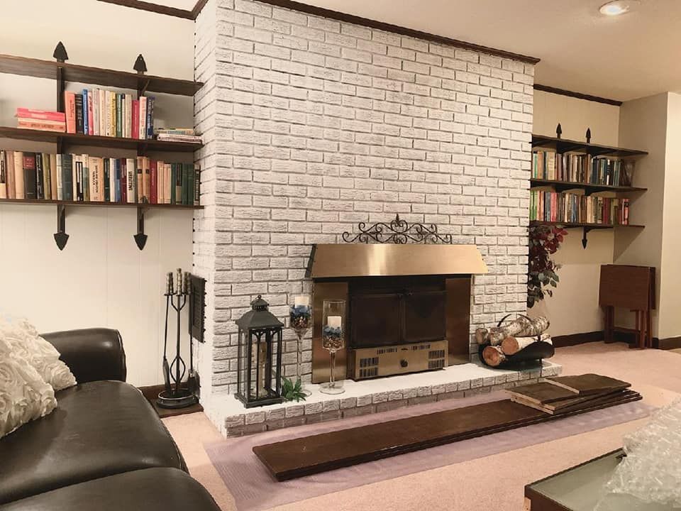 A red house with a white porch and stairs