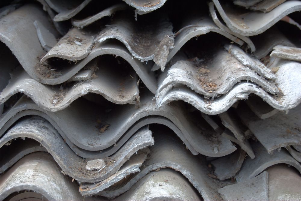 A Pile of Roof Tiles Are Stacked on Top of Each Other — Ballina Demolitions In Grafton, NSW