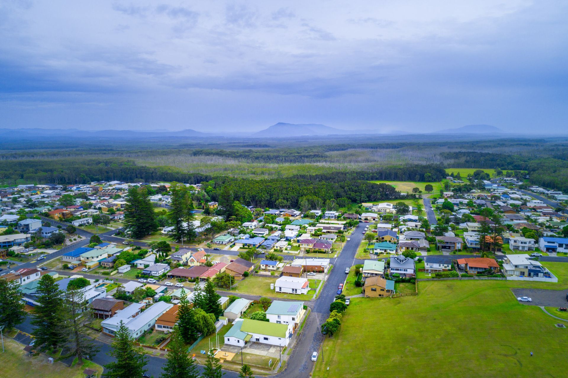 An Aerial View Of A Residential Area With A Mountain In The Background — Ballina Demolitions In Goonellabah, NSW
