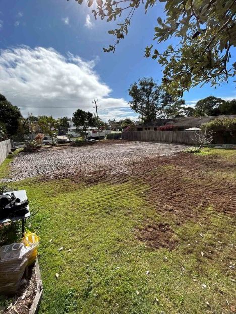 A Large Grassy Field With A Fence And Trees In The Background — Ballina Demolitions In East Wardell, NSW