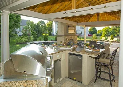 A kitchen with a stainless steel grill and a dishwasher