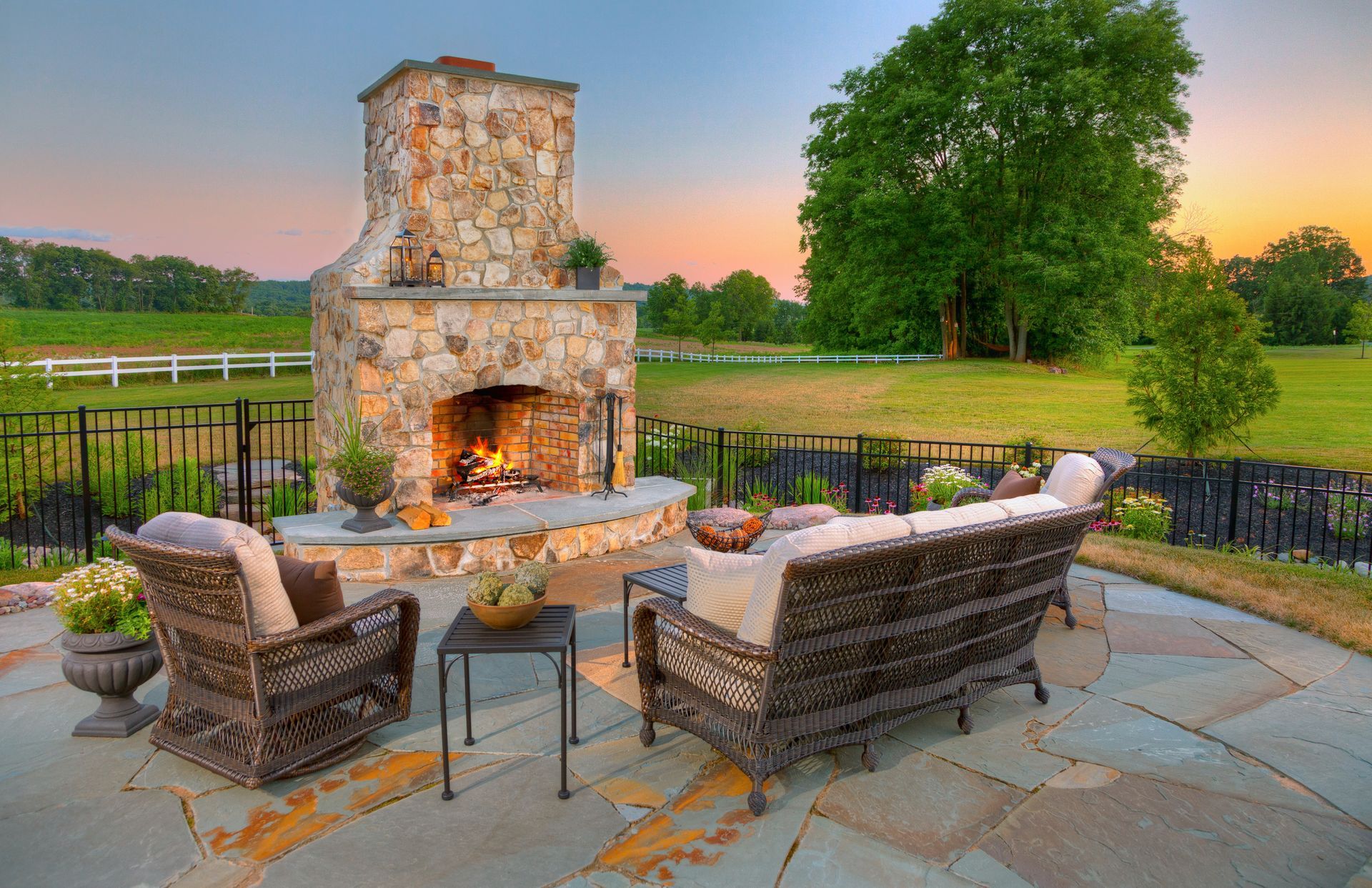 There is a fireplace in the middle of the patio.
