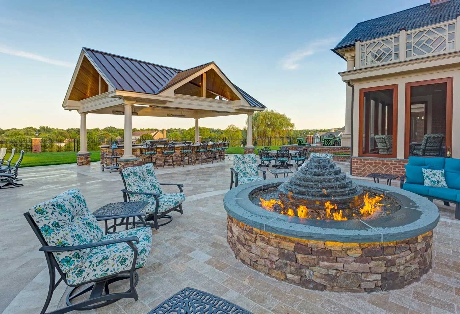 There is a fire pit in the middle of the patio.