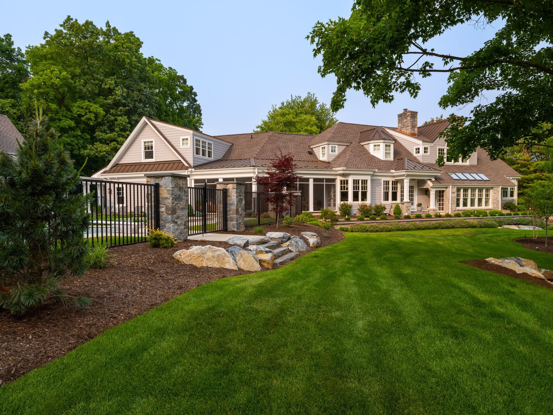 A large house with a large lawn in front of it