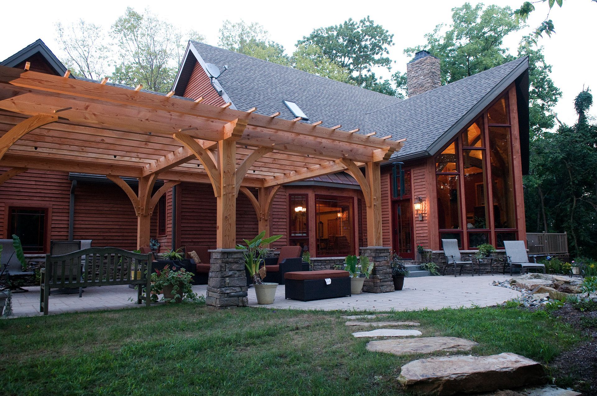 A large house with a pergola in front of it