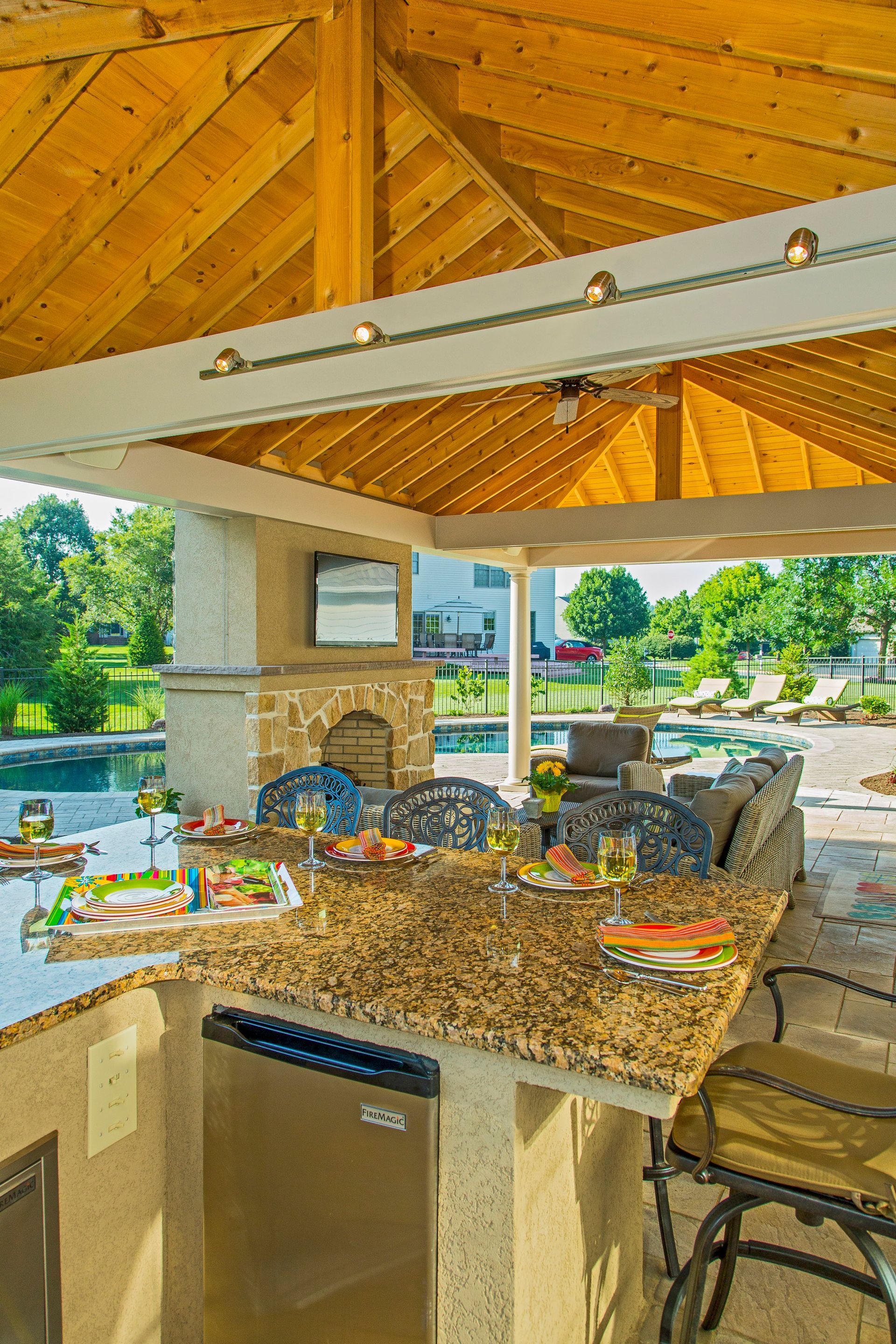 A kitchen with a granite counter top and a stainless steel dishwasher.