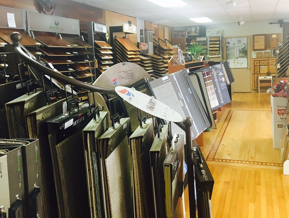 A store filled with lots of different types of carpets