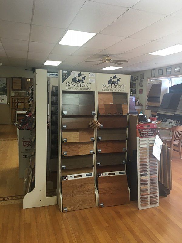 There are many different types of wood flooring on display in this store.