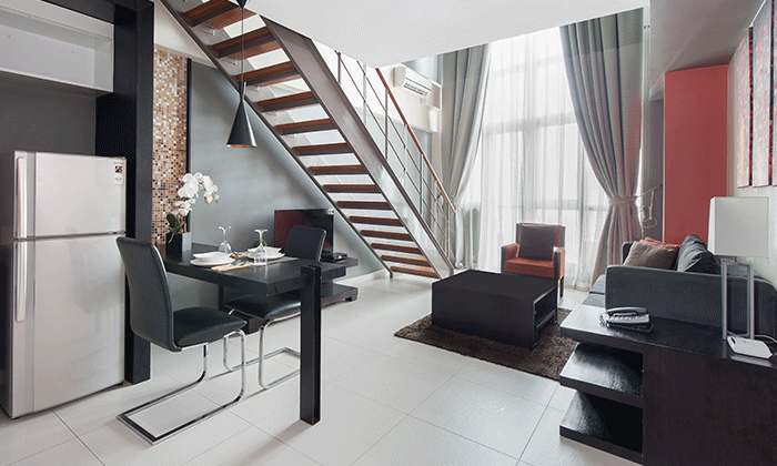 The interior of a spacious two-level loft at a premier Greenbelt hotel in Makati, designed for the modern business traveler.