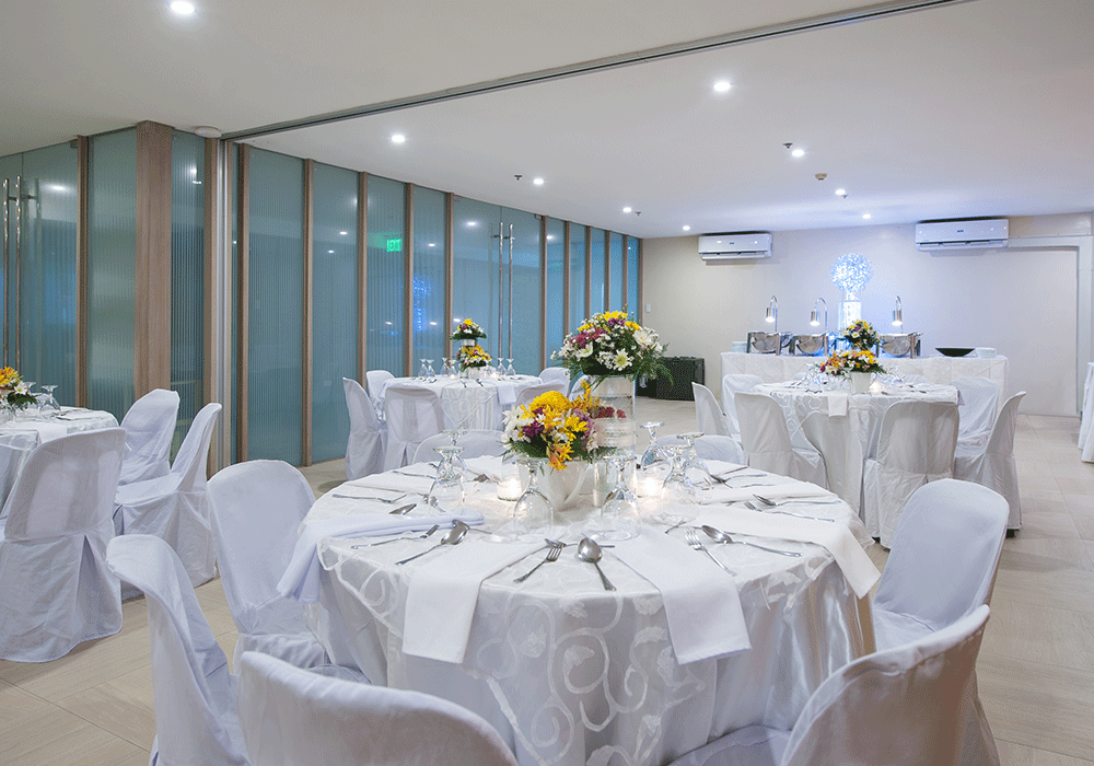 KL Tower: A spacious function hall with a banquet setup, showcasing the versatile options at one of the top hotels with meeting rooms in Makati.