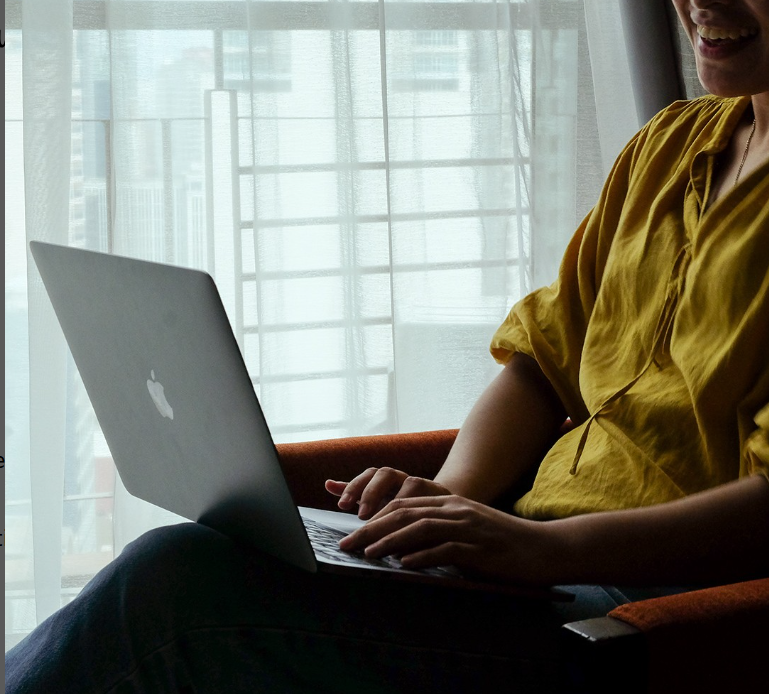 A business traveler working on a laptop in a comfortable suite, showcasing why this is a top choice among hotels near Greenbelt.