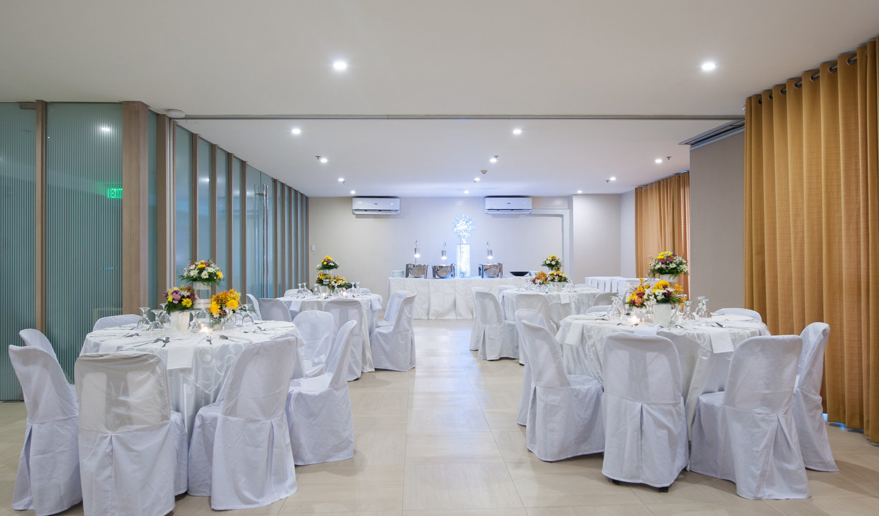 KL Tower: A spacious function hall with a banquet setup, showcasing the versatile options at one of the top hotels with meeting rooms in Makati.