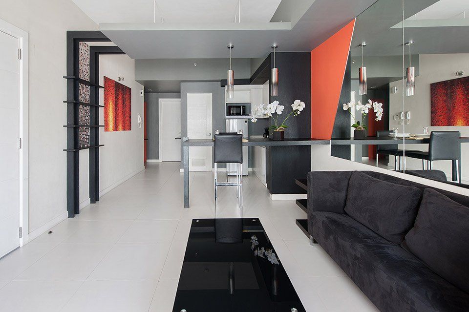 The spacious interior of a modern apartment-style suite at KL Serviced Residences, a premier Greenbelt hotel in Makati for extended stays.