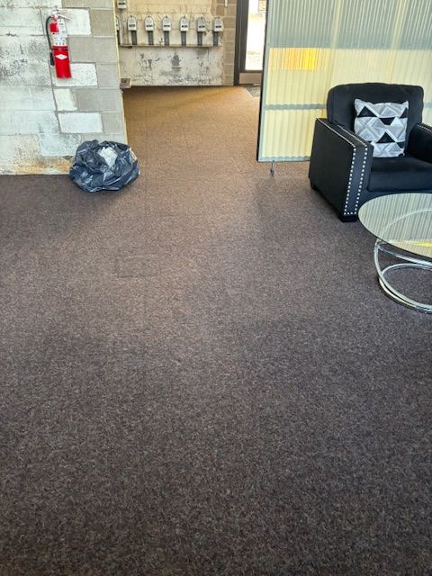 A living room with a chair and a coffee table