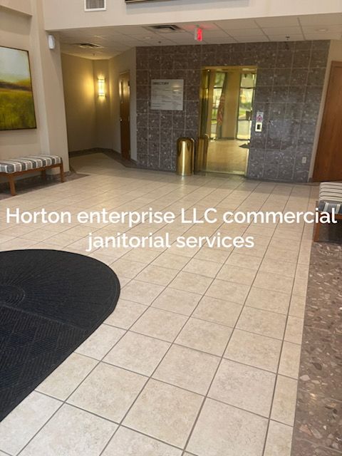 A hallway with a sign that says horton enterprise llc commercial janitorial services