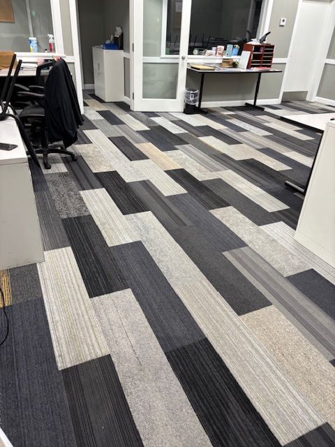 A room with a black and white striped floor