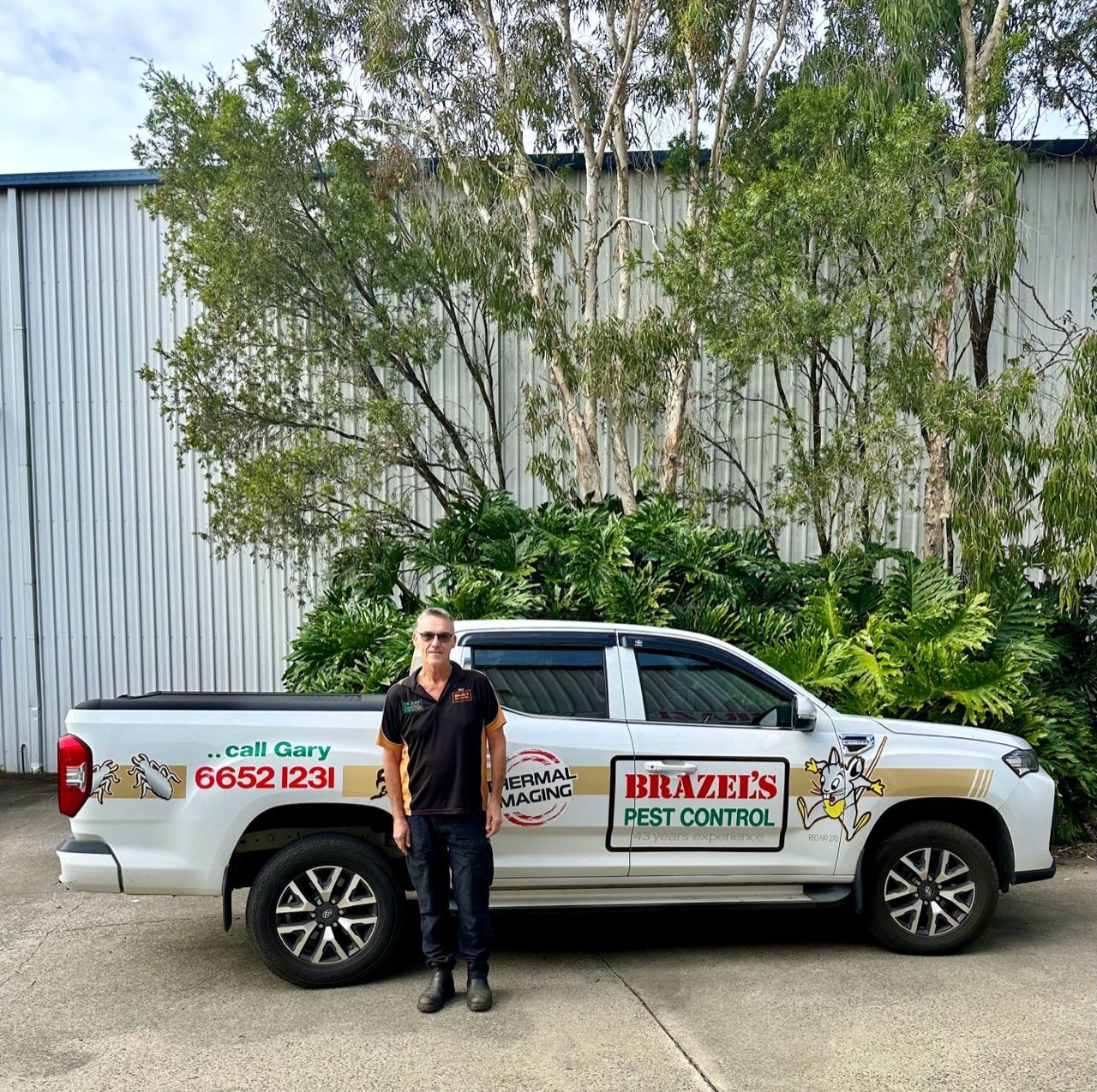 Pest Control Business Ute With Man Infront Of Vehicle — Brazel's Pest Control in Coffs Harbour, NSW