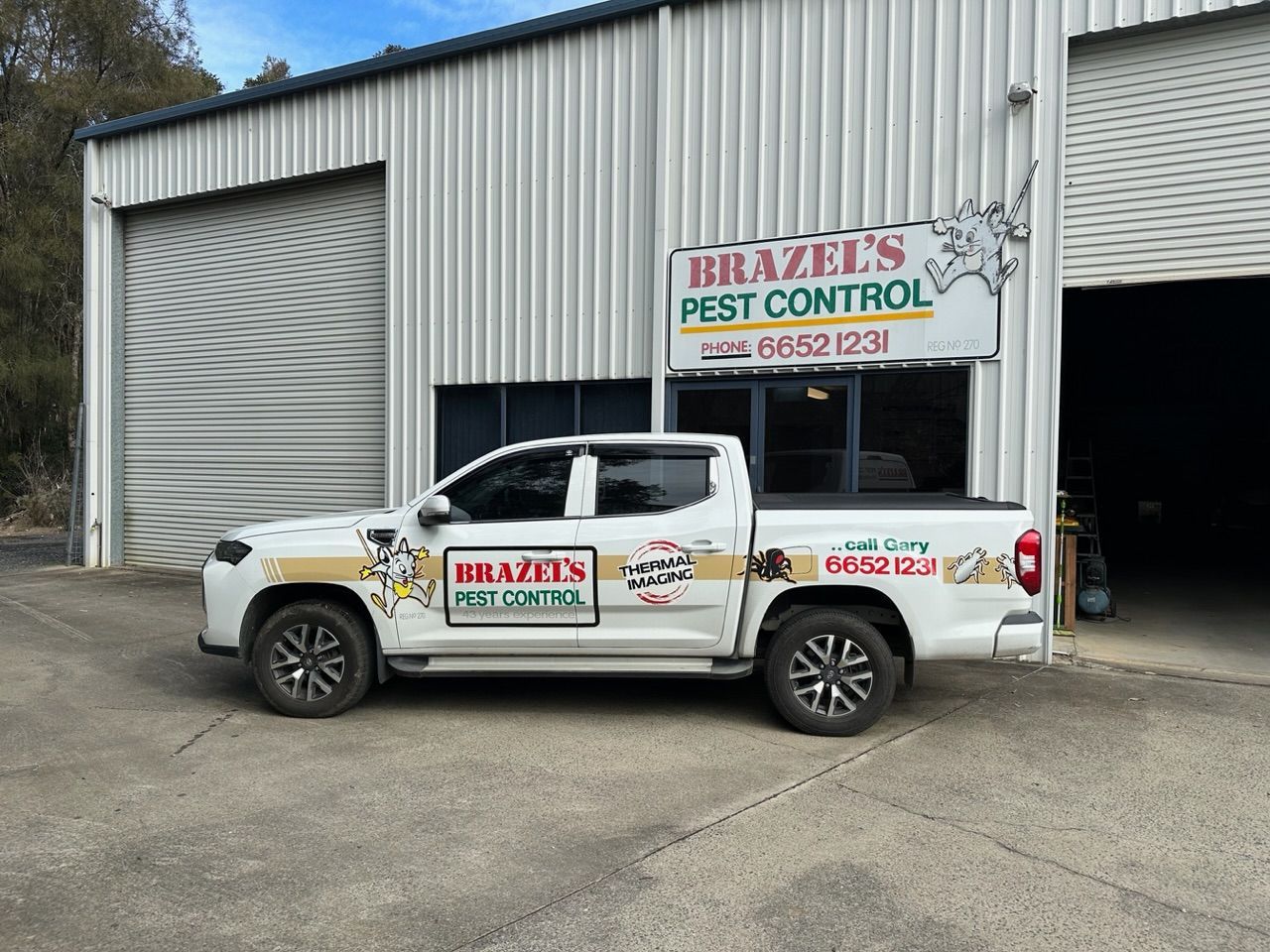 Pest Control Ute Infront Of Work Building — Brazel's Pest Control in Coffs Harbour, NSW