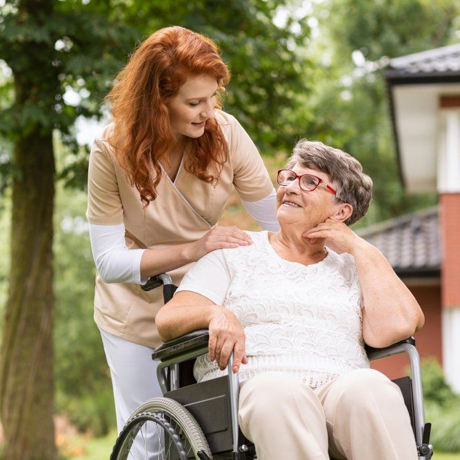 Female Volunteer Helping Elderly Woman — Aged Care Services in Paget, QLD