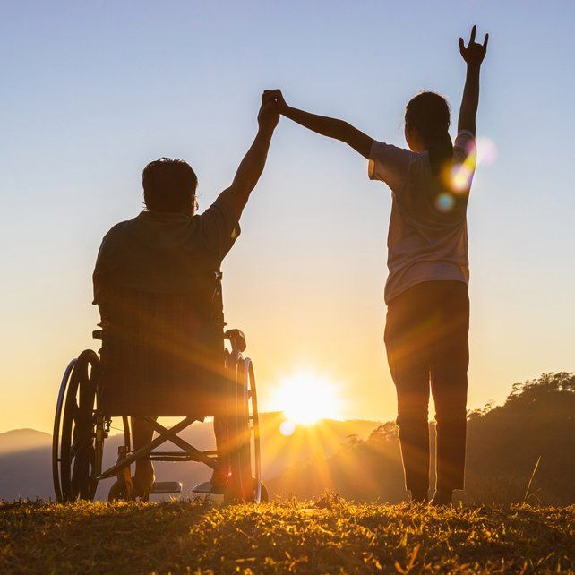 Man In Wheelchair with Female Volunteer — Aged Care Services in Paget, QLD