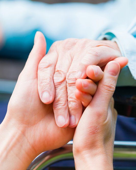 Person Holding Elderly Woman's Hand — Aged Care Services in Paget, QLD