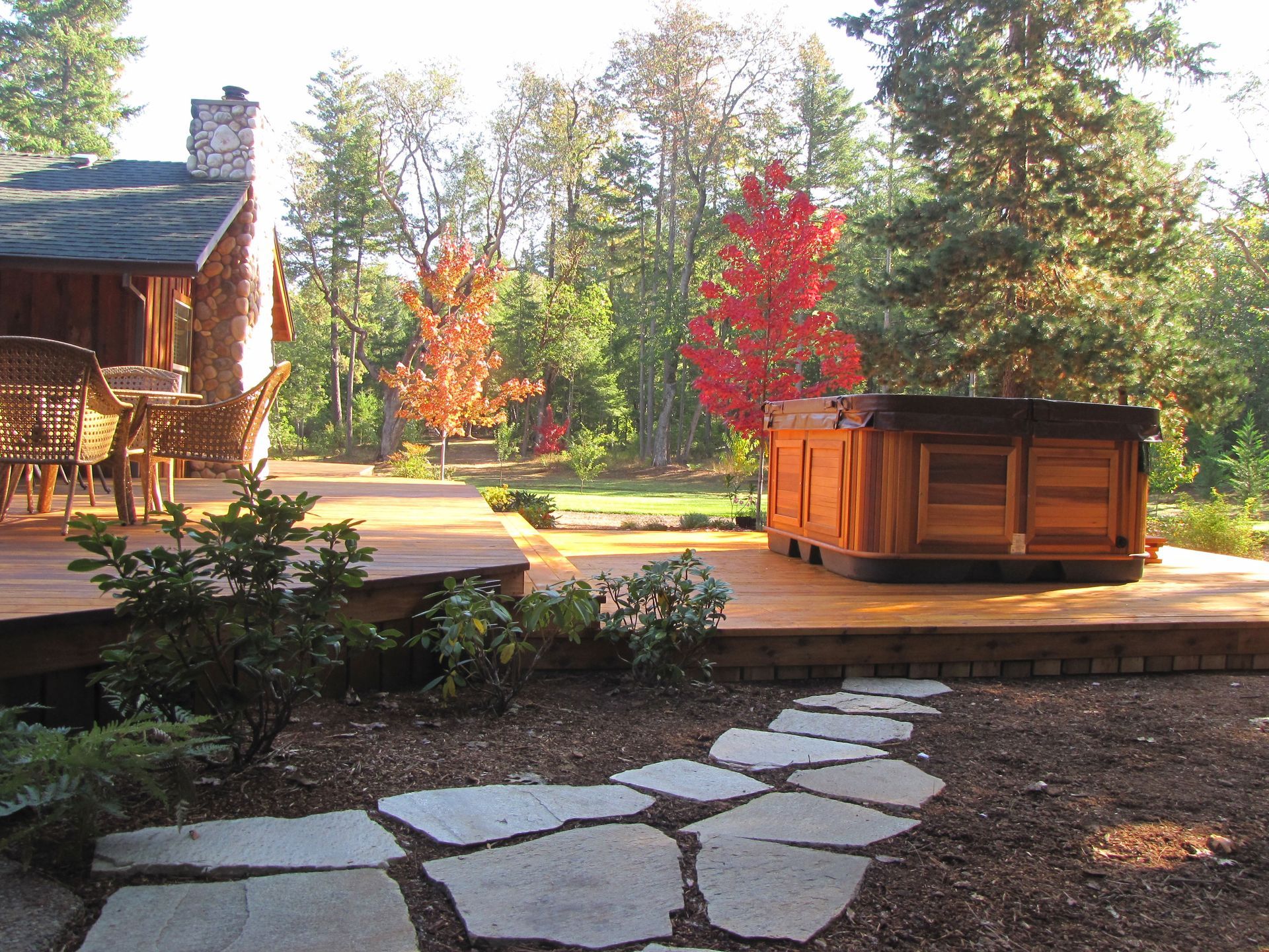 A wooden deck with a hot tub on it